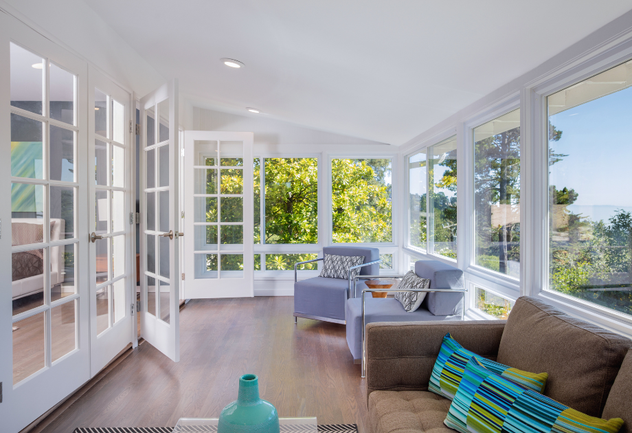 a sunroom with luxury vinyl plank